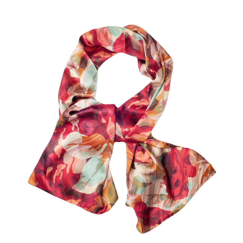 pink floral silk scarf tied into knot